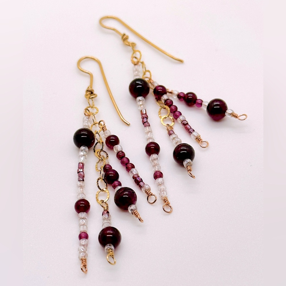 Handmade earrings with Garnets, glass seed beads and gold-fill wire and chain.